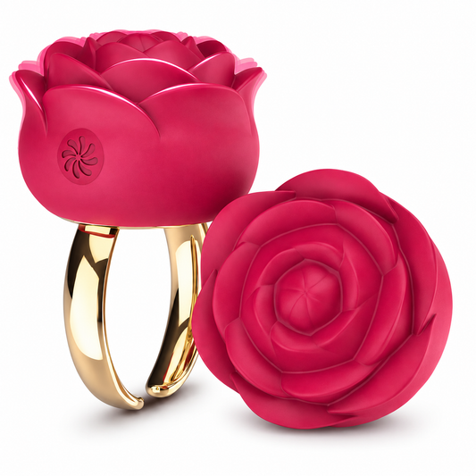 A rose-shaped ring with a glossy deep pink bloom and a polished gold band, shown alongside a matching detached rose-shaped component on a white background.